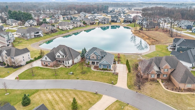 aerial view featuring a water view and a residential view
