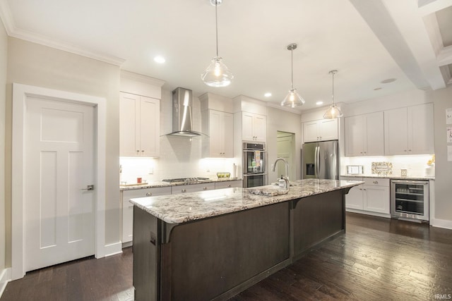 kitchen featuring wall chimney range hood, dark wood-style floors, wine cooler, and stainless steel appliances
