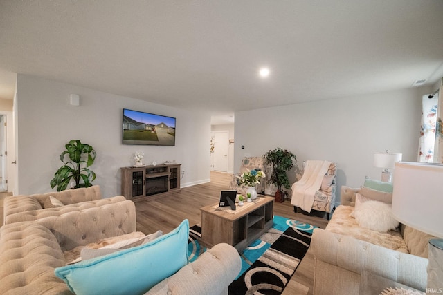 2751 Sand Hollow Dr, Lebanon, IN 46052 - living room featuring baseboards, wood finished floors, and recessed lighting