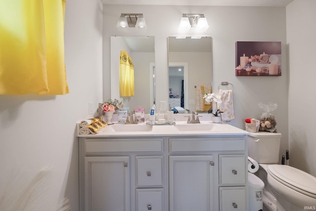 2751 Sand Hollow Dr, Lebanon, IN 46052 - ensuite bathroom with a sink, double vanity, connected bathroom, and toilet