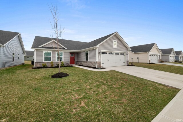 2751 Sand Hollow Dr, Lebanon, IN 46052 - view of front of house with a front lawn, driveway, stone siding, and an attached garage