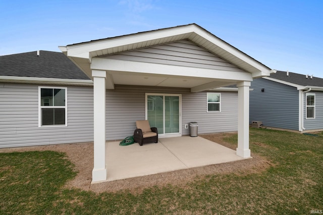 2751 Sand Hollow Dr, Lebanon, IN 46052 - back of house featuring a shingled roof, a patio area, and a yard