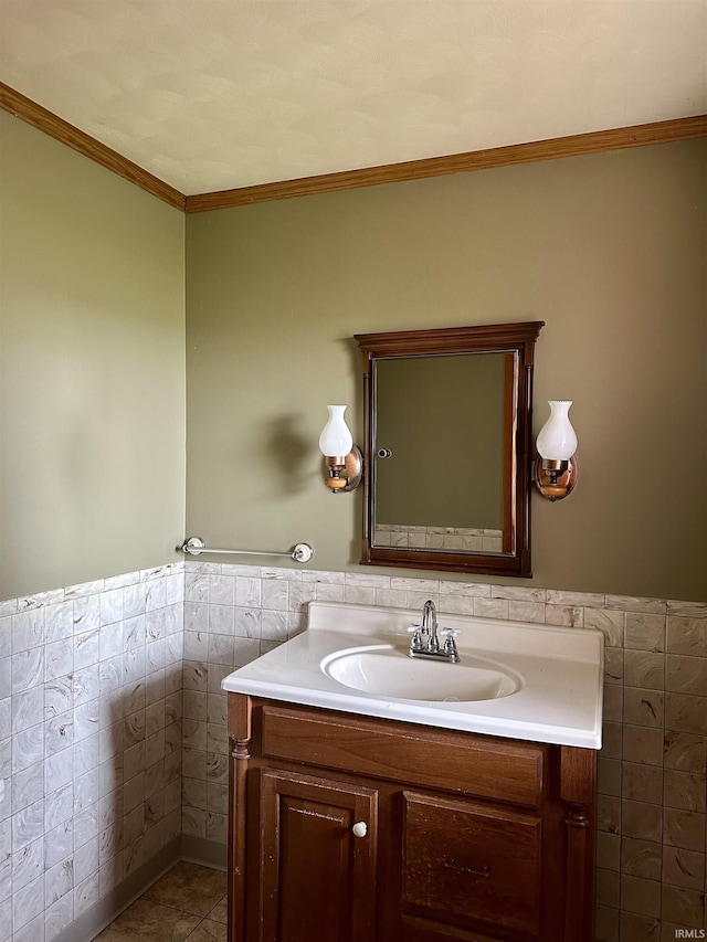 bathroom featuring tile walls, a wainscoted wall, and ornamental molding