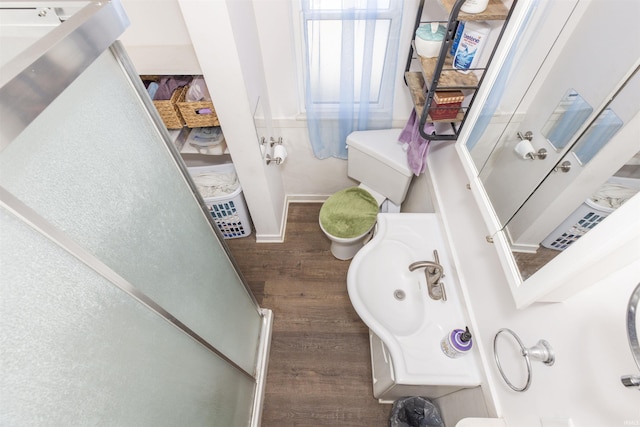 bathroom featuring toilet and wood finished floors
