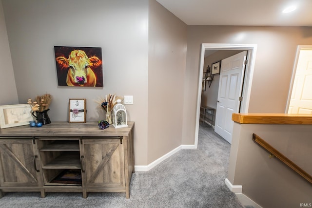 2860 E Moffett Ln, Bloomington, IN 47401 - corridor with carpet flooring, an upstairs landing, and baseboards