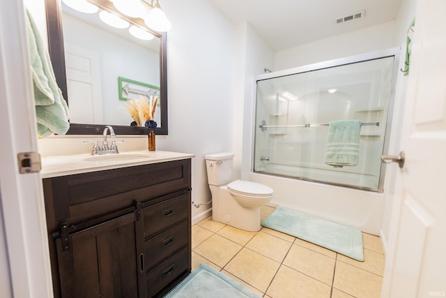 2860 E Moffett Ln, Bloomington, IN 47401 - bathroom featuring visible vents, toilet, tile patterned floors, vanity, and shower / bath combination with glass door
