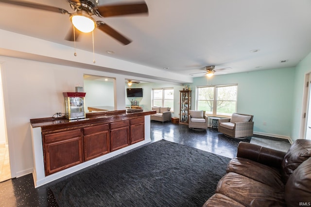 2860 E Moffett Ln, Bloomington, IN 47401 - living room featuring baseboards and a ceiling fan