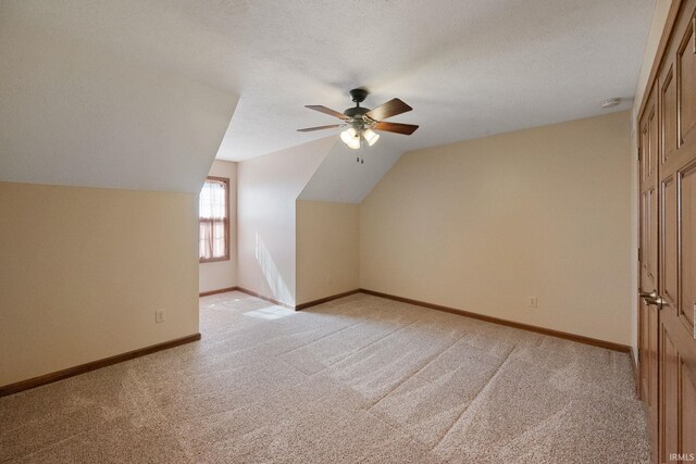 4277 S 100 W, Williamsport, IN 47993 - bonus room with vaulted ceiling, a ceiling fan, a textured ceiling, baseboards, and light colored carpet