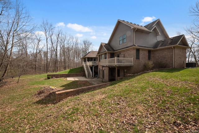 4277 S 100 W, Williamsport, IN 47993 - rear view of property with a wooden deck, a patio, stairs, brick siding, and a lawn