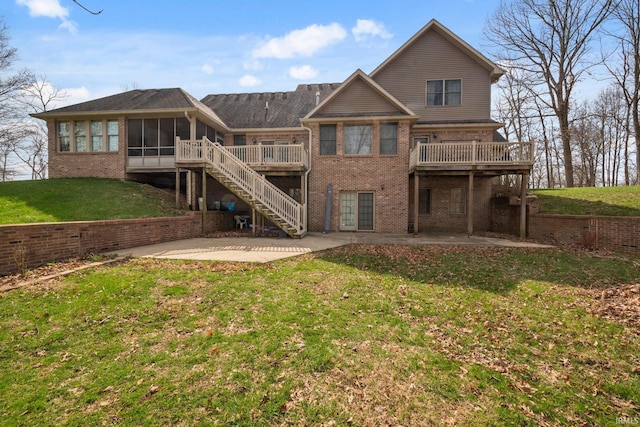 4277 S 100 W, Williamsport, IN 47993 - back of house with a lawn, a sunroom, brick siding, and a patio area