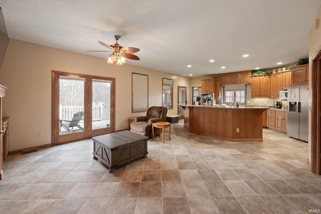 4277 S 100 W, Williamsport, IN 47993 - living room with visible vents, baseboards, recessed lighting, a ceiling fan, and french doors