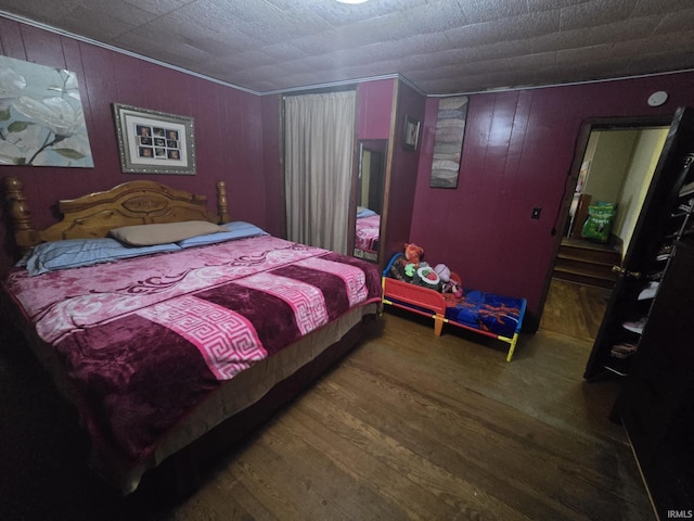 bedroom with wood finished floors