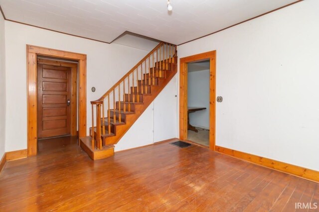2645 S Greensboro Pike, New Castle, IN 47362 - interior space featuring hardwood / wood-style floors, visible vents, baseboards, and stairway