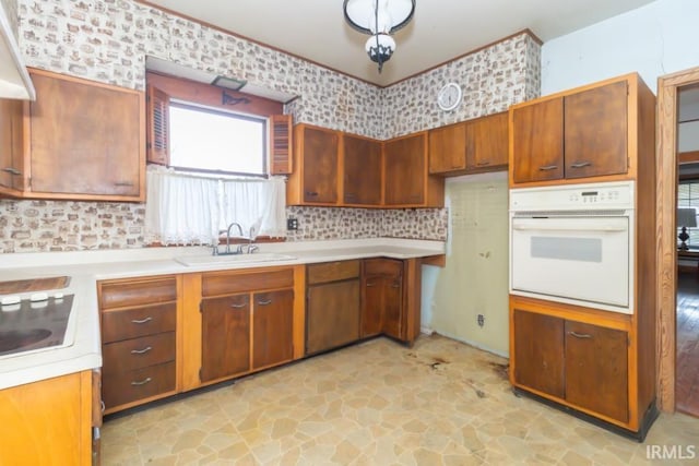 2645 S Greensboro Pike, New Castle, IN 47362 - kitchen with light countertops, cooktop, white oven, a sink, and stone finish flooring