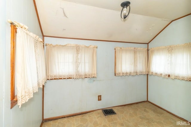 2645 S Greensboro Pike, New Castle, IN 47362 - empty room with ornamental molding, visible vents, and vaulted ceiling