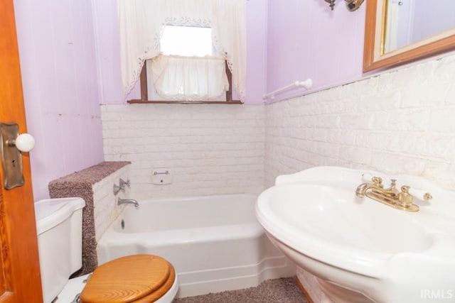 2645 S Greensboro Pike, New Castle, IN 47362 - bathroom featuring a tub, a sink, and toilet