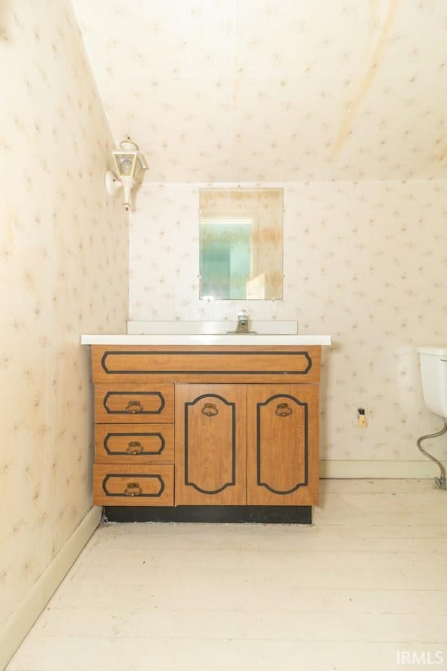 2645 S Greensboro Pike, New Castle, IN 47362 - bathroom with baseboards, wallpapered walls, toilet, and vanity