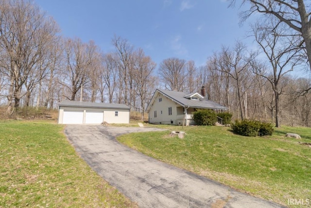 2645 S Greensboro Pike, New Castle, IN 47362 - view of property exterior with an outdoor structure, a yard, and a detached garage