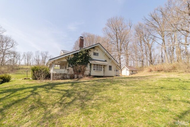 2645 S Greensboro Pike, New Castle, IN 47362 - exterior space featuring a chimney and a yard