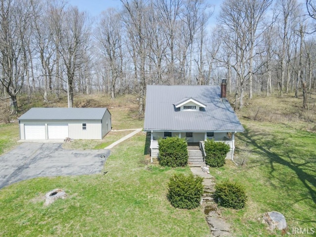 2645 S Greensboro Pike, New Castle, IN 47362 - view of front of house with a front yard, a chimney, an outbuilding, metal roof, and a detached garage