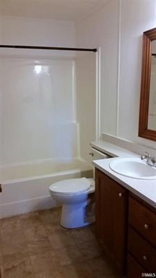 905 Stewart Ave, Evansville, IN 47715 - bathroom with vanity, toilet, and bathing tub / shower combination