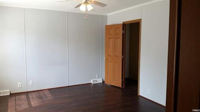 905 Stewart Ave, Evansville, IN 47715 - unfurnished room with ceiling fan, dark wood-type flooring, and ornamental molding