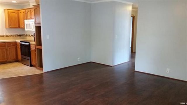 905 Stewart Ave, Evansville, IN 47715 - kitchen featuring electric range, ornamental molding, wood finished floors, white microwave, and light countertops