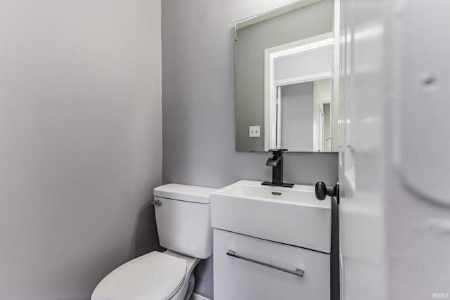 bathroom with toilet and vanity
