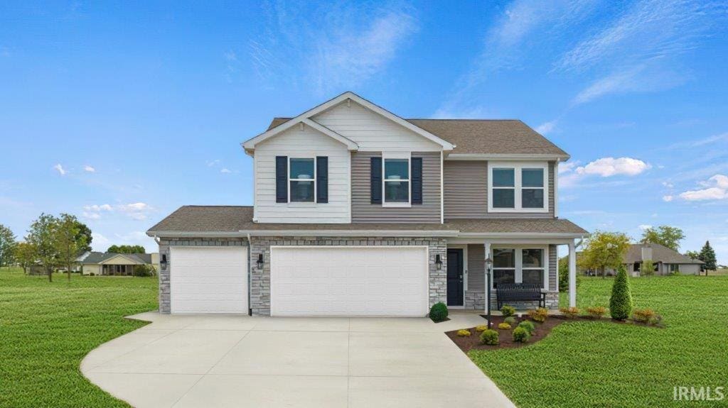 23506 Harvest Ln, Woodburn, IN 46797 - view of front of home with a front yard, stone siding, concrete driveway, a shingled roof, and a garage
