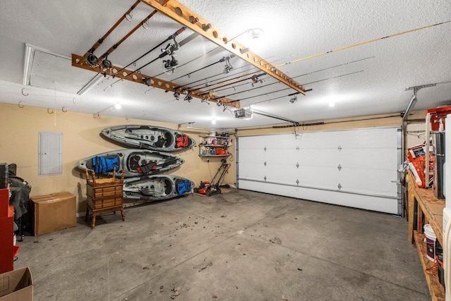 garage with electric panel and a garage door opener