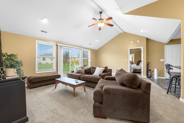 carpeted living area featuring baseboards, vaulted ceiling with beams, visible vents, and a ceiling fan