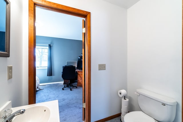 2680 S 390 W, Pleasant Lake, IN 46779 - half bath featuring baseboards, toilet, and a sink