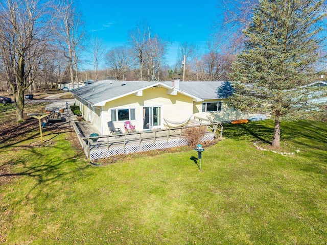 2680 S 390 W, Pleasant Lake, IN 46779 - rear view of property featuring a deck, a yard, and a chimney