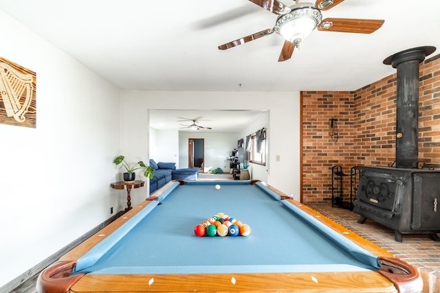 2680 S 390 W, Pleasant Lake, IN 46779 - rec room with pool table, ceiling fan, baseboards, and a wood stove