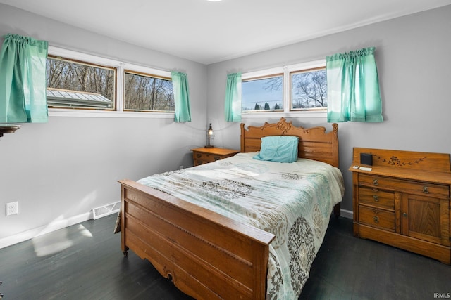 5255 E Bay Front Ct, Monticello, IN 47960 - bedroom featuring baseboards, visible vents, and wood finished floors
