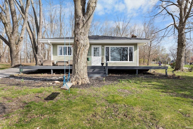 5255 E Bay Front Ct, Monticello, IN 47960 - back of house with a lawn and a chimney