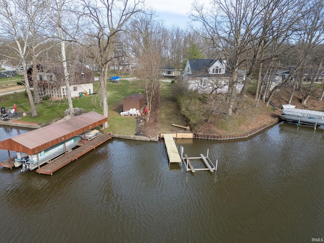 5255 E Bay Front Ct, Monticello, IN 47960 - view of dock with boat lift, a water view, and a yard