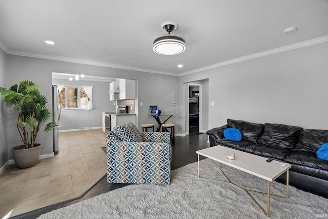 5255 E Bay Front Ct, Monticello, IN 47960 - living area with baseboards, visible vents, light tile patterned flooring, and crown molding