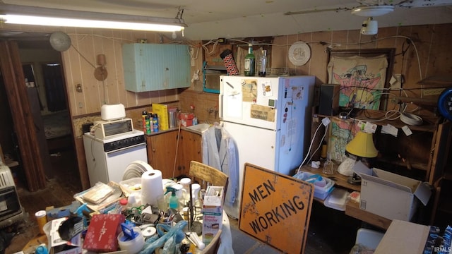 kitchen featuring freestanding refrigerator