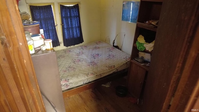 bedroom with wood finished floors