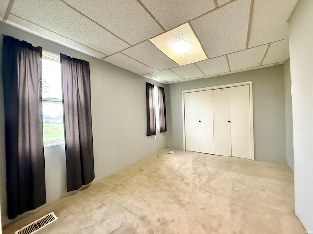 603 N Maple St, Converse, IN 46919 - unfurnished bedroom featuring carpet flooring, a closet, a drop ceiling, and visible vents