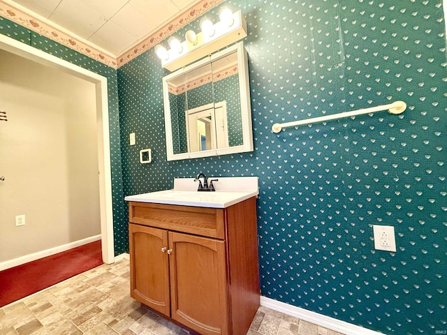 603 N Maple St, Converse, IN 46919 - bathroom featuring vanity, stone finish flooring, and baseboards