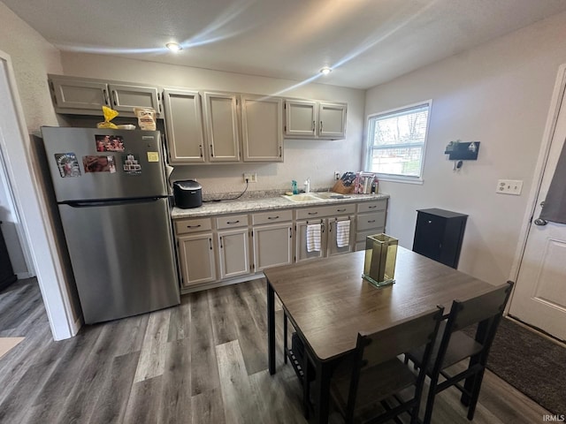328 Barbie St, South Bend, IN 46614 - kitchen featuring light countertops, freestanding refrigerator, wood finished floors, and a sink