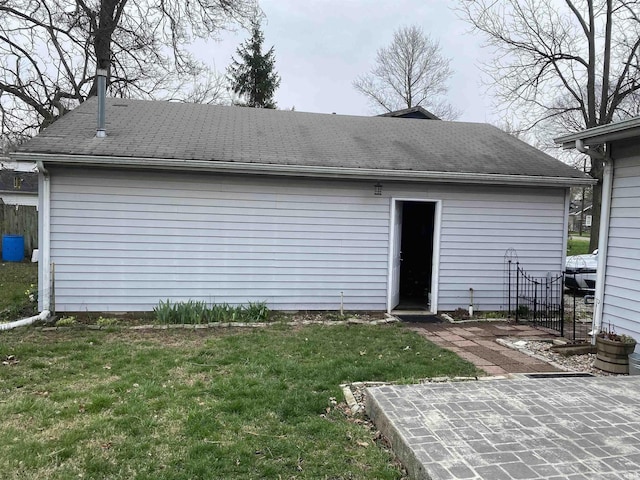 rear view of property with a lawn, fence, and a patio area