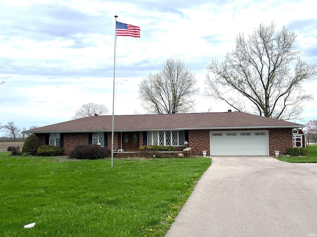 7976 W State Road 54, Switz City, IN 47465 - single story home with driveway, a garage, a front lawn, and brick siding
