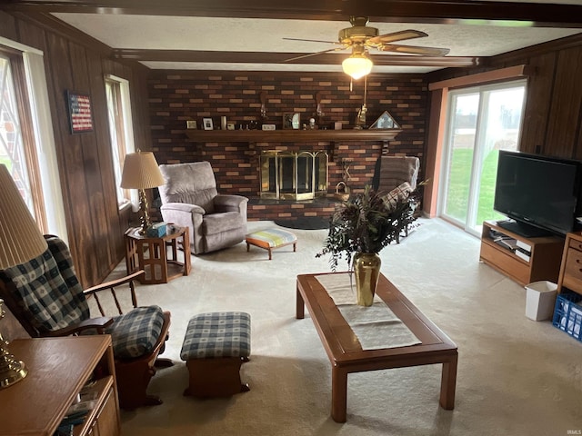 7976 W State Road 54, Switz City, IN 47465 - living room with beamed ceiling, a fireplace, a ceiling fan, carpet floors, and wooden walls