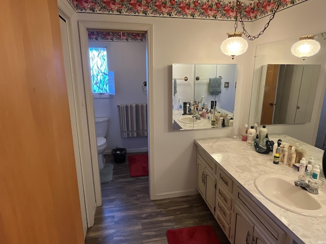 7976 W State Road 54, Switz City, IN 47465 - bathroom with toilet, wood finished floors, vanity, and baseboards