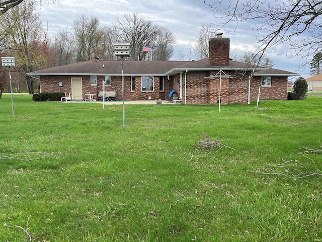 7976 W State Road 54, Switz City, IN 47465 - back of property with a yard, brick siding, cooling unit, and a chimney