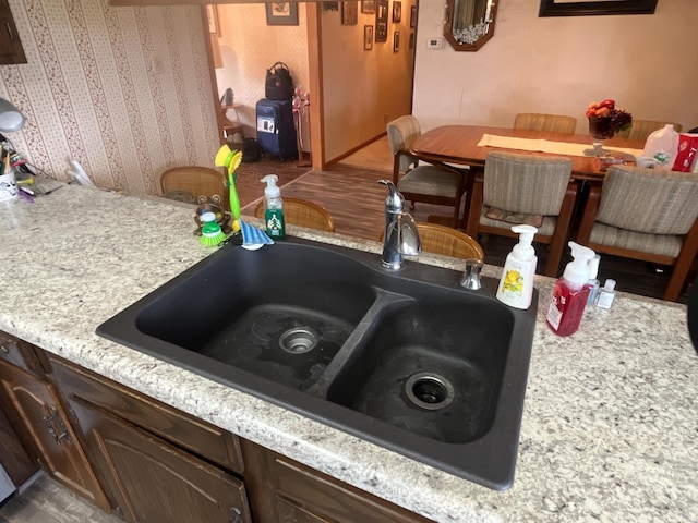 7976 W State Road 54, Switz City, IN 47465 - kitchen with a sink, dark brown cabinets, and light countertops