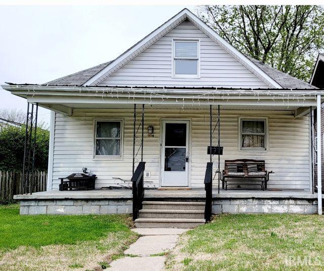 bungalow with roof with shingles and covered porch